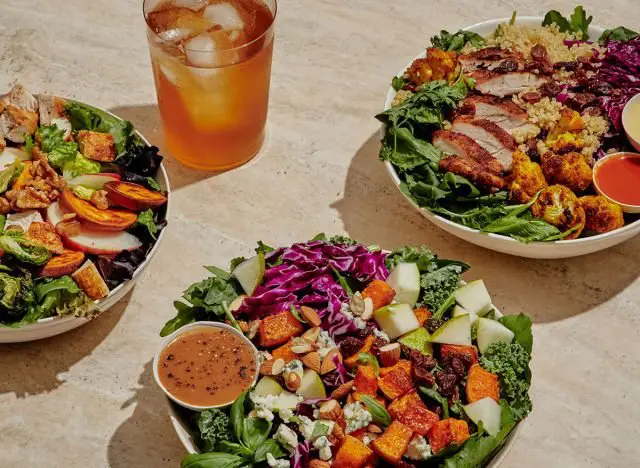 three personalized bowls of sweetgreens with iced tea