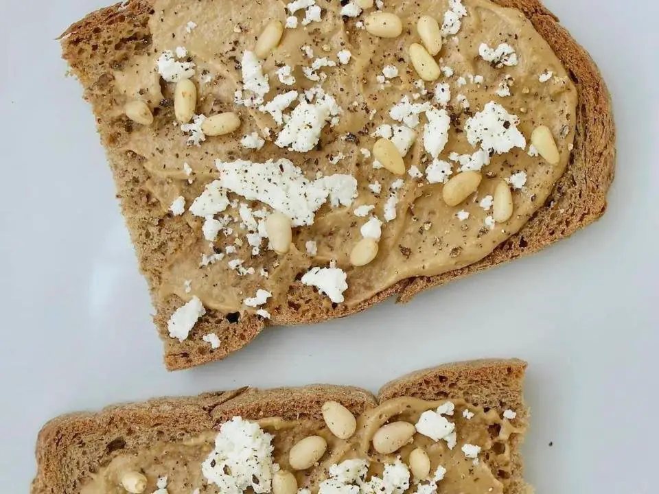 Tahini, feta and pine nuts on whole-wheat toast.