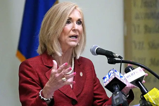 Lynn Fitch speaks into microphones at Central Mississippi Correctional Facility in Pearl, Miss.