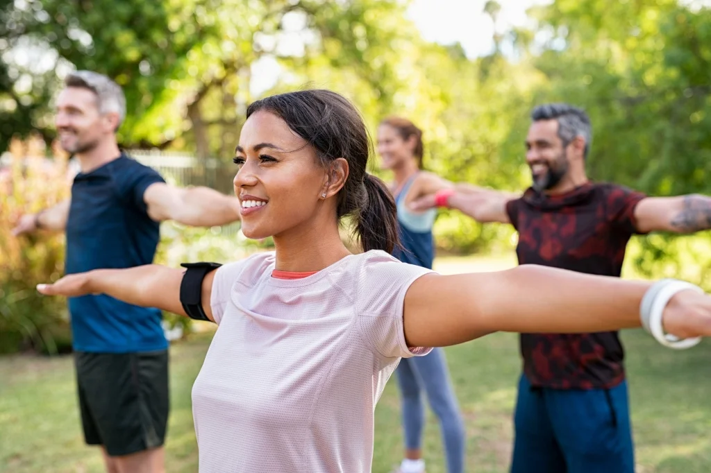 Woman's arms outstretched in exercise.