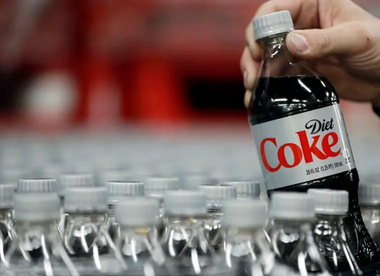 A bottle of Diet Coke is taken for quality control testing at a Coco-Cola bottling plant in Salt Lake City, Utah